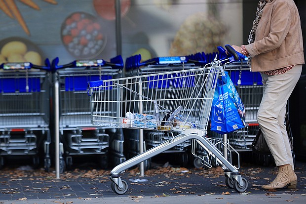 A customer pushes a shopping cart and bags outside a supermarket operated by Aldi Einkauf GmbH & Co., also known as Aldi Nord, in central Berlin, Germany, on Tuesday, Oct. 4.
Mandatory Credit: Krisztian Bocsi/Bloomberg/Getty Images