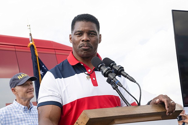(L-R) Rick Scott, Herschel Walker New poll finds Georgia Senate race remains unchanged after allegations about Herschel Walker, here speaking during a campaign stop on October, 11, Carrollton, Georgia.
Mandatory Credit:	Megan Varner/AP