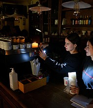 Missile attacks on the western Ukrainian city of Lviv have left many homes and businesses without power.
Mandatory Credit:	Yuriy Dyachyshyn/AFP/Getty Images