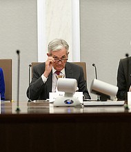 Flanked by Vice Chairs of the Board of Governors of the Federal Reserve Lael Brainard and Michael Barr, Chairman Jerome Powell delivers opening remarks during an event in  Washington, D.C. on September 23.
Mandatory Credit:	Kevin Lamarque/Reuters