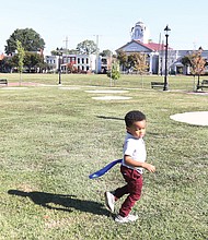 In the renovated Abner Clay Park in Historic Jackson Ward following the rededication and ribbon-cutting Friday, Oct. 7, 2022, the 3-year- old great-great-grandson of Mr. Clay, Oliver Clay Glasby, takes advantage of the spacious park just as his great-great- grandfather would want him to do.