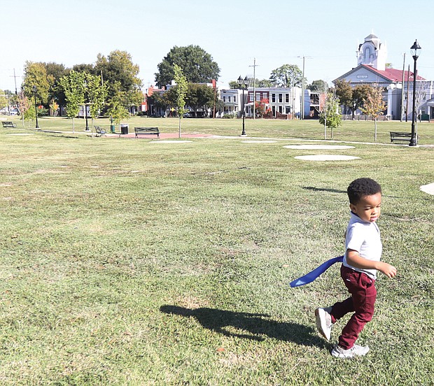 In the renovated Abner Clay Park in Historic Jackson Ward following the rededication and ribbon-cutting Friday, Oct. 7, 2022, the 3-year- old great-great-grandson of Mr. Clay, Oliver Clay Glasby, takes advantage of the spacious park just as his great-great- grandfather would want him to do.