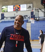 Philadelphia 76ers Head Coach Doc Rivers speaks with Danuel House after practice Sept. 27 on the first day of the 76ers NBA basketball training camp at the McAlister Field House on the campus of The Citadel in Charleston, S.C.