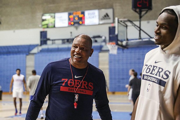 Philadelphia 76ers Head Coach Doc Rivers speaks with Danuel House after practice Sept. 27 on the first day of the 76ers NBA basketball training camp at the McAlister Field House on the campus of The Citadel in Charleston, S.C.