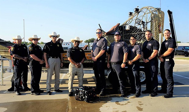 Representing the Fort Bend County Sheriff’s Office and Northeast Fire Department Regional Dive Team are (l to r) Patrol Lt. Josh Dale, Patrol Major James Burger,
Asst. Chief Manuel Zamora, Sheriff Eric Fagan, Fire Chief Travis Baxter, Asst. Fire Chief Robert Gomez, Capt. Donney Guebara, and firefighters Christian Bruner and Robert Valdez.