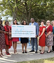 Aflac presents TSU with grant.