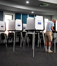 Voters cast their vote in the Blue Ash, Ohio Municipal building for the primary, on August 2.
Mandatory Credit: Liz Dufour/The Cincinnati Enquirer/AP