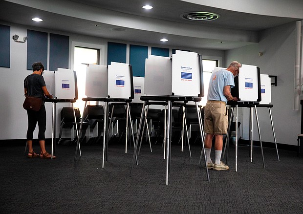 Voters cast their vote in the Blue Ash, Ohio Municipal building for the primary, on August 2.
Mandatory Credit:	Liz Dufour/The Cincinnati Enquirer/AP