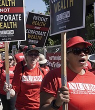 California mental health workers vote Friday to end the 10-week strike. Kaiser Permanente mental health workers and supporters here march outside a Kaiser facility in Sacramento, California, on August 15.
Mandatory Credit:	Rich Pedroncelli/AP
