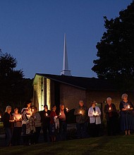Mourners gather at Beacon Baptist Church for a vigil after five people were gunned down in Raleigh, North Carolina. The 15-year-old boy who allegedly killed five people and injured two last week in Raleigh was found with a shotgun, a handgun, and a knife.
Mandatory Credit:	Melissa Sue Gerrits/Getty Images