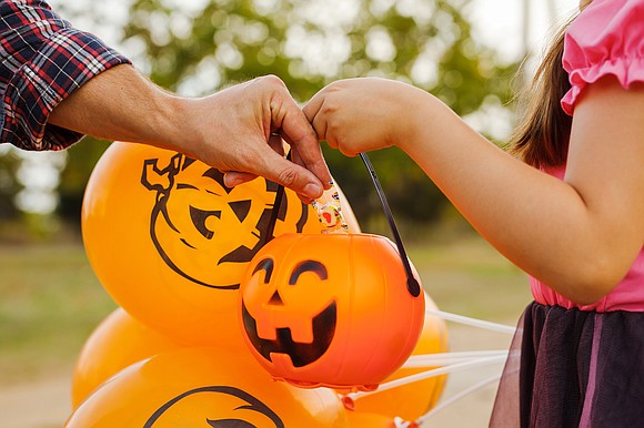 Limiting your child's candy this Halloween might be more of a trick than a treat, experts say.