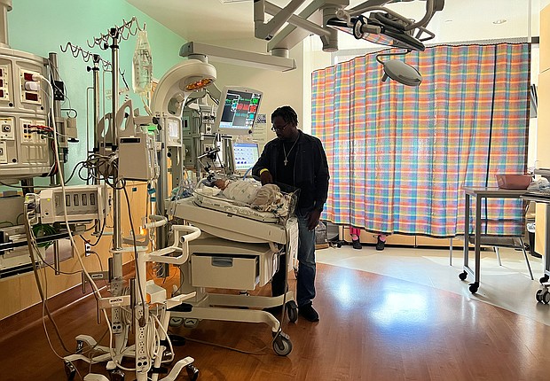 Stephen Balka stands over his son Adrian, who is hospitalized at Texas Children's Hospital with RSV.
Mandatory Credit:	Rosa Flores/CNN