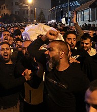 At least four Palestinians were killed during an Israeli military raid in the old city of Nablus in the West Bank on October 25, according to the Palestinian Ministry of Health. Mourners in the West Bank are pictured here.
Mandatory Credit:	Jaafar Ashtiyeh/AFP/Getty Images