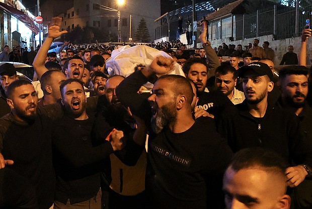 At least four Palestinians were killed during an Israeli military raid in the old city of Nablus in the West Bank on October 25, according to the Palestinian Ministry of Health. Mourners in the West Bank are pictured here.
Mandatory Credit:	Jaafar Ashtiyeh/AFP/Getty Images