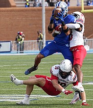 Kymari Gray holds on to the ball during Hampton University’s match against the University of Richmond on Oct. 22 in Hampton. The Pirates were disappointed by the loss, but still celebrated its homecoming in grand style.