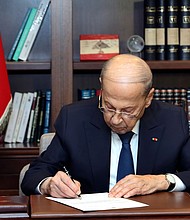Lebanese President Michel Aoun signs the US-brokered deal setting a maritime border between Lebanon and Israel, at the presidential palace in Beirut.
Mandatory Credit:	Dalati Nohra/Lebanese Government/AP