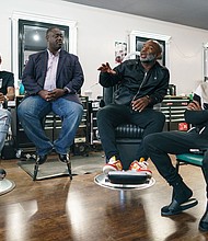 Aaron Bethea, second from right, speaks during a discussion about voting with other Black men at Anytime Cutz barbershop.
Mandatory Credit: Elijah Nouvelage for CNN