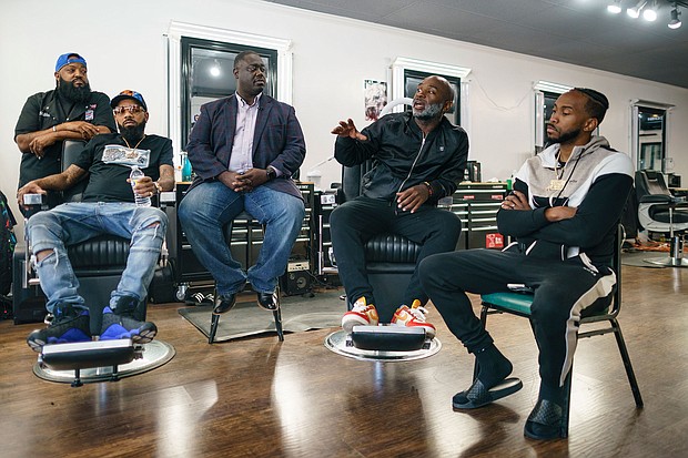 Aaron Bethea, second from right, speaks during a discussion about voting with other Black men at Anytime Cutz barbershop.
Mandatory Credit:	Elijah Nouvelage for CNN