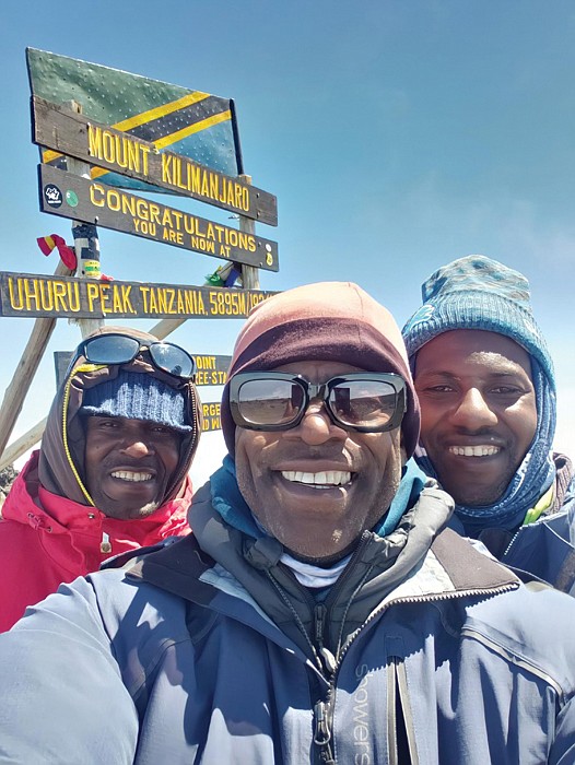 Robert Dortch at the summit of Mount Kilimanjaro with two of his Tanzanian guides, left John Masawe, Robert Dortch and Emmanuel Kimaro.