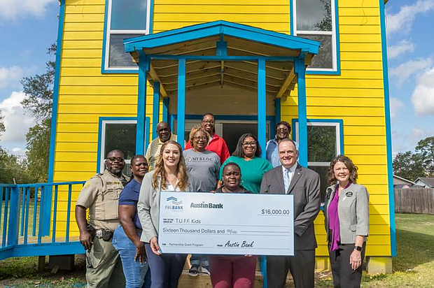 Representatives from Austin Bank, Texas N.A. and the Federal Home Loan Bank of Dallas awarded $16,000 in partnership grant program funds to TUFF Kids, a nonprofit in Cleveland, Texas.