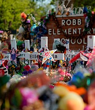 A judge in Uvalde has sealed autopsy reports of those killed during the Robb Elementary School mass shooting in May. Pictured is a makeshift memorial for the school victims on July 10, in Uvalde, Texas.
Mandatory Credit:	Eric Gay/AP