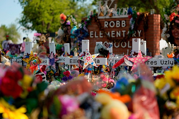 A judge in Uvalde has sealed autopsy reports of those killed during the Robb Elementary School mass shooting in May. Pictured is a makeshift memorial for the school victims on July 10, in Uvalde, Texas.
Mandatory Credit:	Eric Gay/AP