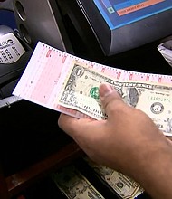 Powerball players should hold on to their tickets through Tuesday morning, when the winning numbers for the largest lottery jackpot ever are expected to be announced after Monday night's drawing was delayed, the Multi-State Lottery Association said.
Mandatory Credit:	CNN