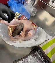 A gun was found inside a raw chicken at an airport security checkpoint.
Mandatory Credit:	TSA