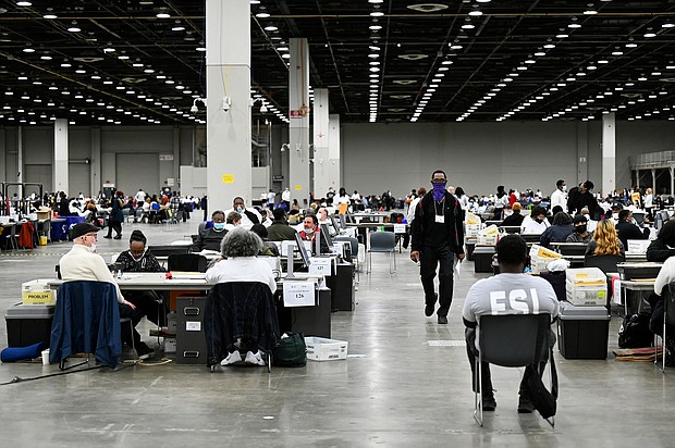 The votes have been cast. Now comes the race to finish counting -- and the potential legal fights. In this image, ballot counters process absentee ballots on November 8 in Detroit.
Mandatory Credit: Jose Juarez/AP