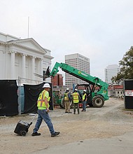 Construction continues at Virginia’s Capitol Square as seen here last month. The Capitol Visitor Center has been closed to the public since May 2 for numerous projects. According to a press release from the Department of General Services, the closure is expected to continue until next month, during which time the historic Capitol will remain open. All visitors must use the west entrance to the Capitol, where they are screened upon entry. Buses, tour groups and other large multiple-passenger vehicles can unload on the eastern-most lane of 9th Street near the Capitol Square vehicular entrance at Grace Street. Individuals who need accessibility accommodations and are arriving via a passenger vehicle can call (804) 389-5338 and arrange for drop-off inside Capitol Square. It is advised that all Capitol Square visitors should stay clear of fenced construction areas for safety reasons. The subterranean Visitor Center opened in 2007 and includes two large event/meeting rooms, a café, gift shop, exhibit space, and a media room. The closure of the Capitol Visitor Center is necessary for DGS to safely complete both critical waterproofing and tunnel construction projects.