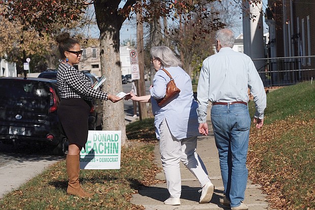 Rae Cousins campaigns for incumbent congressional candidate A. Donald McEachin in the 800 block of 31st Street near in Church Hill on Tuesday.