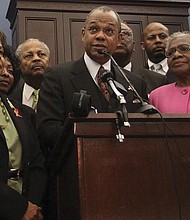 Rep. Barbara Lee, D-Calif., the Rev. Calvin Butts, and Rep. Alcee Hastings, D-Fla., are joined at podium by other church and community leaders from New York, in March 2010 on Capitol Hill. Rev. Butts welcomed generations of worshippers as well as politicial leaders from across the world at Harlem’s landmark Abyssinian Baptist Church.