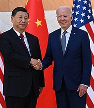 President Joe Biden (R) and China's President Xi Jinping shakes hands as they meet on the sidelines of the G20 Summit in Bali, Indonesia, on November 14.
Mandatory Credit:	Saul Loeb/AFP/Getty Images
