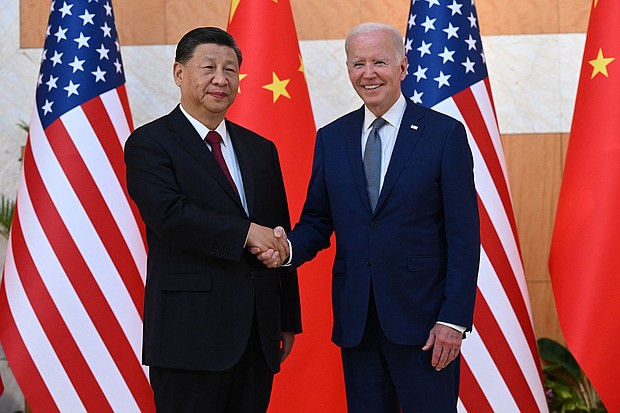 President Joe Biden (R) and China's President Xi Jinping shakes hands as they meet on the sidelines of the G20 Summit in Bali, Indonesia, on November 14.
Mandatory Credit:	Saul Loeb/AFP/Getty Images