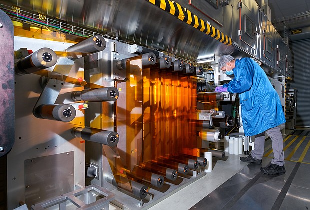 General Motors Fuel Cell Controls and Process Engineer Joe Truchan operates a coating machine in the fuel cell laboratory at the GM Global Propulsion Systems Pontiac Engineering Center in Pontiac, Michigan. (Photo by Steve Fecht for General Motors)