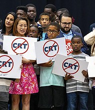 Children holding signs against Critical Race Theory stand on stage near Florida Gov. Ron DeSantis as he addresses the crowd before publicly signing HB7 at Mater Academy Charter Middle/High School in Hialeah Gardens, Fla., on April 22, 2022. Republican groups that sought to get hundreds of “parents’ rights” activists elected to local school boards largely fell short in this year’s Nov. 8 elections. The push has been boosted by Republican groups including the 1776 Project PAC, but just a third of its roughly 50 candidates won.