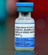 A file photo shows a vial of a measles, mumps, and rubella vaccine in Mount Vernon, Ohio, in May 2019. A growing measles outbreak in Columbus, Ohio, has sickened dozens of unvaccinated children and hospitalized nine of them.
Mandatory Credit:	Paul Vernon/AP