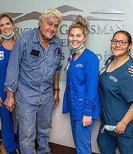 Jay Leno has been discharged from the hospital after sustaining burn injuries in a gasoline fire. Leno is seen here with the staff of the Grossman Burn Center on November 21.
Mandatory Credit:	From Grossman Burn Center