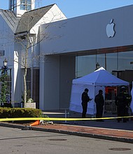 Emergency services personnel attend the scene after a vehicle crashed into an Apple store in Hingham, Massachusetts, Monday, November 21.
Mandatory Credit:	Brian Snyder/Reuters