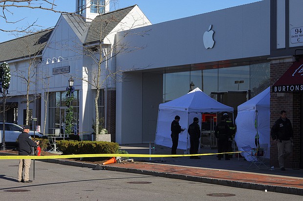 Emergency services personnel attend the scene after a vehicle crashed into an Apple store in Hingham, Massachusetts, Monday, November 21.
Mandatory Credit:	Brian Snyder/Reuters