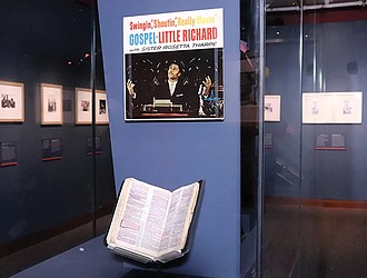 A Bible owned by Little Richard, placed beneath an album cover titled “Swingin’, Shoutin, Really Movin’ Gospel” at “Spirit in the Dark: Religion in Black Music, Activism and Popular Culture,” a new exhibition of the Smithsonian’s National Museum of African American History and Culture.