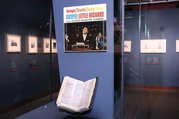 A Bible owned by Little Richard, placed beneath an album cover titled “Swingin’, Shoutin, Really Movin’ Gospel” at “Spirit in the Dark: Religion in Black Music, Activism and Popular Culture,” a new exhibition of the Smithsonian’s National Museum of African American History and Culture.