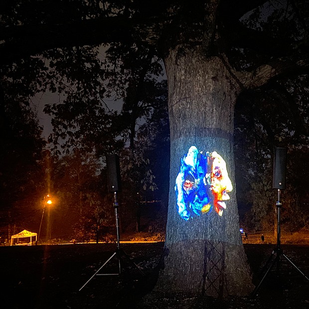 Among the exhibits was Eric Millikin’s “Cyborgs for Rebellion, 2022.” Composed of artificial intelligence, 3D modeling, animation, audio and video projection, the work is “an infinitely rotating series of poetry reading, three dimensional portraits projected onto trees of Joseph Bryan Park, where participants in Gabriel’s Rebellion gathered 222 years ago.”