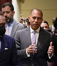 Rep. Hakeem Jeffries, D-N.Y., talks with reporters Thursday on Capitol Hill in Washington. The day after Speaker Nancy Pelosi announced she would step aside, Rep. Jeffries announced his own history-making bid Friday to become the first Black American to helm a major U.S. political party in Congress as leader of the House Democrats.