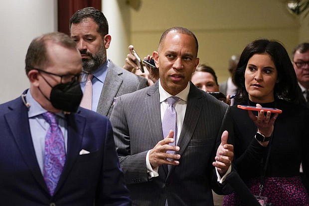 Rep. Hakeem Jeffries, D-N.Y., talks with reporters Thursday on Capitol Hill in Washington. The day after Speaker Nancy Pelosi announced she would step aside, Rep. Jeffries announced his own history-making bid Friday to become the first Black American to helm a major U.S. political party in Congress as leader of the House Democrats.