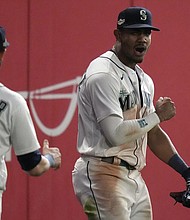 Seattle Mariners center fielder Julio Rodriguez celebrates after making a catch for an out
against the Houston Astros.