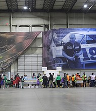 About 1,100 families patiently stood in line at the Richmond Raceway for Operation Harvest, the annual Thanksgiving food distribution project hosted by The Saint Paul’s Baptist Church and supported by 30 partners. This year’s distribution took place at the Richmond Raceway on Nov. 17.