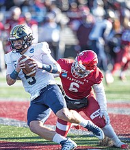 VUU’s Damontay Rhem, No. 6, pressures Wingate’s QB Shaw Crocker, No. 5., during the Panther’s 32-7 Hovey Field loss to Wingate in the Division II, Super Region 2 Regional.