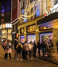People wait in line to enter Macy's department store during Black Friday in New York City on November 25.
Mandatory Credit:	Yuki IIwamura/AFP/Getty Images