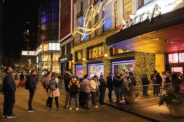 People wait in line to enter Macy's department store during Black Friday in New York City on November 25.
Mandatory Credit:	Yuki IIwamura/AFP/Getty Images
